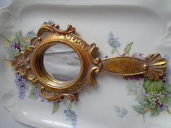 Gold baroque hand mirror.