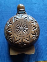 Folk carved wooden bottle with glass interior