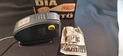 Retro slide projector, efilm (filmed works) record goods factory, in its own box...