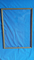 Old, gold-colored, glass, thin picture frame