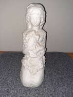 White ceramic girl statue