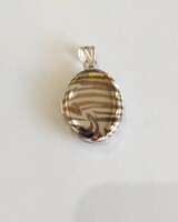 New, silver openable photo holder pendant with a zebra pattern. 6.31G. (E. 11.)