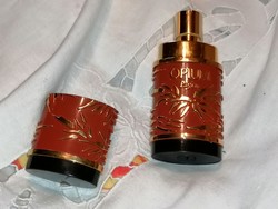 Vintage opium perfume bottle with little perfume.