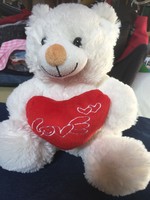 A very soft, lavender-scented teddy bear with a heart with the inscription love