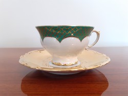 Vintage porcelain cup with gilded old baroque coffee