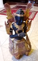 Thai praying thepanom carved gilded statue. An exotic artefact.
