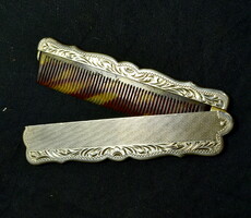XX. No. The first half is an antique beautiful silver sheath comb