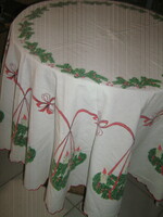 A beautiful oval Christmas tablecloth with an Advent wreath pattern