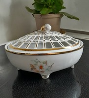 A wonderful gilded porcelain bonbonier with an openwork lid