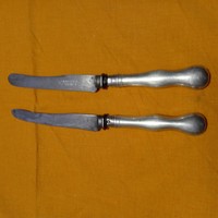 Antique knives with silver handles.