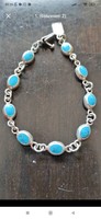 Silver bracelet studded with turquoise stones