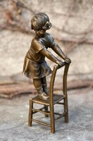 Child playing - bronze statue