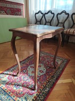 Smoking table with curved legs