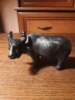 Old painted terracotta buffalo statue