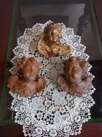 Carved wooden angels in one
