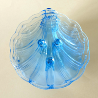 Set of 6 beautiful shell-shaped glass cookies with blue legs and a dessert plate
