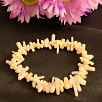 Coral bracelet, a stone of abundance.