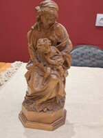 Marked carved statue of Mary with baby