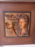 Girl with a dove - terracotta relief