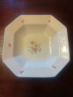 Old granite bowl with an octagonal floral pattern