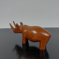 A sculpture of a rhinoceros carved from wood