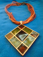 Applied art necklace with a larger pendant, glass insert
