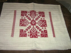 Woven decorative cushion made with beautiful cross-stitch embroidery