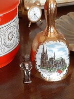 Beautiful porcelain richly decorated with gold bells with a picture of a castle