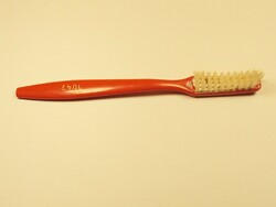 Retro red plastic toothbrush