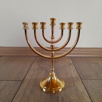 Old gilded menorah, candle holder