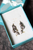 Pierced silver earrings with a special leaf pattern