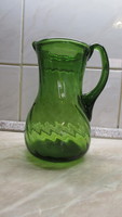 Broken green glass jug