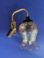 Retro wall lamp with a ruffled hood