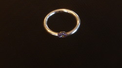 Silver wedding ring with purple translucent stone