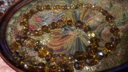 63 cm necklace of mixed size brown and yellow crystal beads.