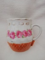 A rosy-bellied mug that is close to a hundred years old