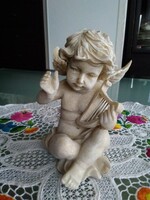 A musical angel, putto with a lifelike peppery finish!