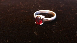 Small silver ring with burgundy stones