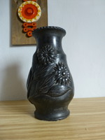 Black ceramic vase with a sunflower pattern
