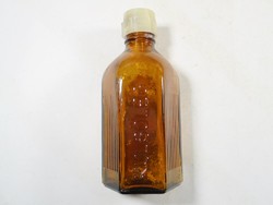 Retro old pharmacy medicine pharmacy apothecary glass bottle with inscription on the outside