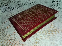 Book-shaped box with leather cover.