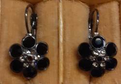 Hook-up earrings in nice condition with a flower-shaped dangle studded with black stones