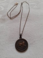 Old, bronze-colored (or the) horoscope (leo) necklace