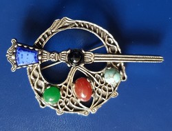 Metal brooch with colored stones with miracle signature
