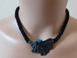 Black twisted cord neck with blue ginkgo biloba pendant