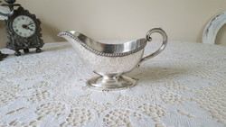 A beautiful silver-plated saucer with a saucer
