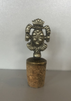 Old wine bottle stopper with decorative metal overlay