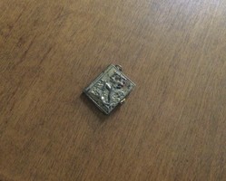 Small copper-covered tourist souvenir book pendant