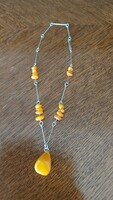 I discounted it! Honey amber necklace with alpaca chain. Beautiful with a big stone in the middle