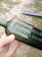 Old tinctured green bottle